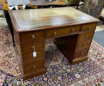 A small William Tillman reproduction George III style mahogany pedestal desk, length 112cm, depth