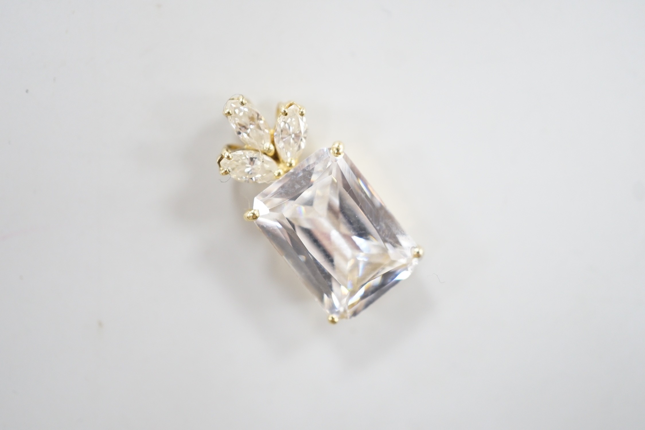 A modern yellow metal mount single stone simulated diamond and three stone diamond set pendant, - Image 2 of 4