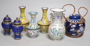 A group of Canton enamel vases, a pair of cloisonné enamel jars and a blue and white jar. Tallest