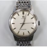 A gentleman's stainless steel Omega Seamaster manual wind wrist watch, on steel Omega bracelet, case