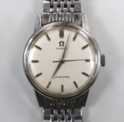 A gentleman's stainless steel Omega Seamaster manual wind wrist watch, on steel Omega bracelet, case