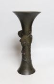 A Japanese bronze beaker vase, 19th century, with bee and vine decoration, 33cms high