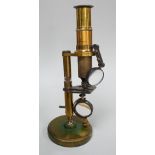 A cased brass monocular microscope