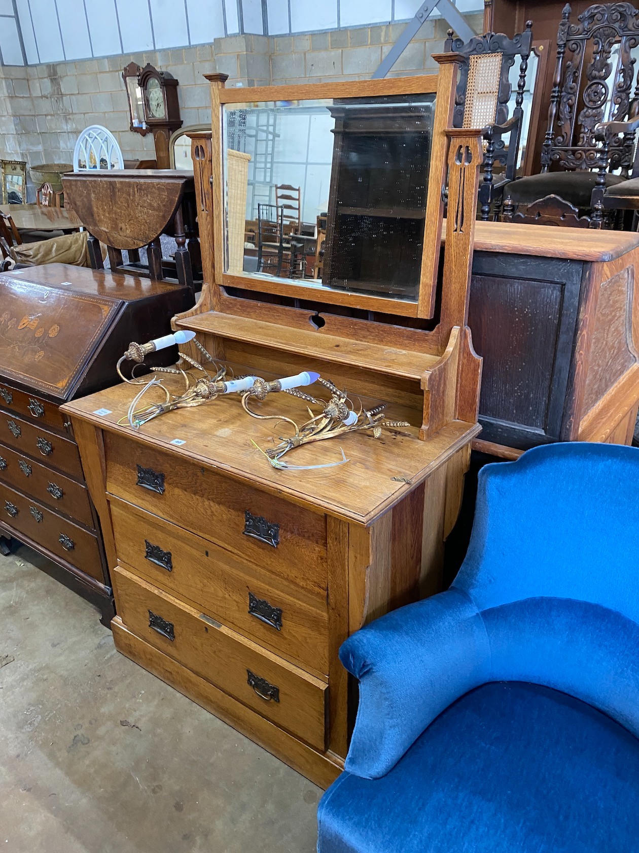 An Arts & Crafts oak dressing chest, width 99cm, depth 53cm, height 164cm