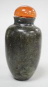 A Chinese green and black jade snuff bottle, 19th century, 5.3 cm Provenance - the former owner