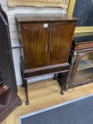 A George III style mahogany cabinet on stand, width 66cm, depth 41cm, height 129cm