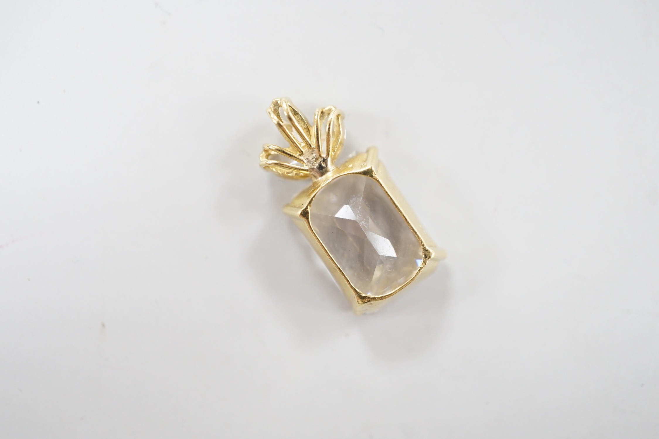 A modern yellow metal mount single stone simulated diamond and three stone diamond set pendant, - Image 4 of 4