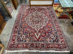 A Mahal burgundy ground carpet, 320 x 210cm