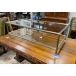 A Maison Jansen style rectangular glass and brass two tier coffee table, length 130cm, depth 70cm,