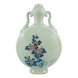 A Chinese underglaze blue and copper red inscribed celadon ground moonflask, 21cm high