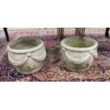 A pair of reconstituted stone circular garden planters with swagged bodies, diameter 38cm, height