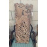 A South East Asian carved wood panel, width 34cm, height 92cm