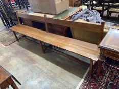 An early 20th century French oak chair back bench, length 250cm, depth 36cm, height 85cm