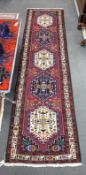 A Caucasian design red ground runner, 290 x 76cm