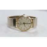 A gentleman's 9ct gold Longines automatic wrist watch, with date aperture, on associated gold plated