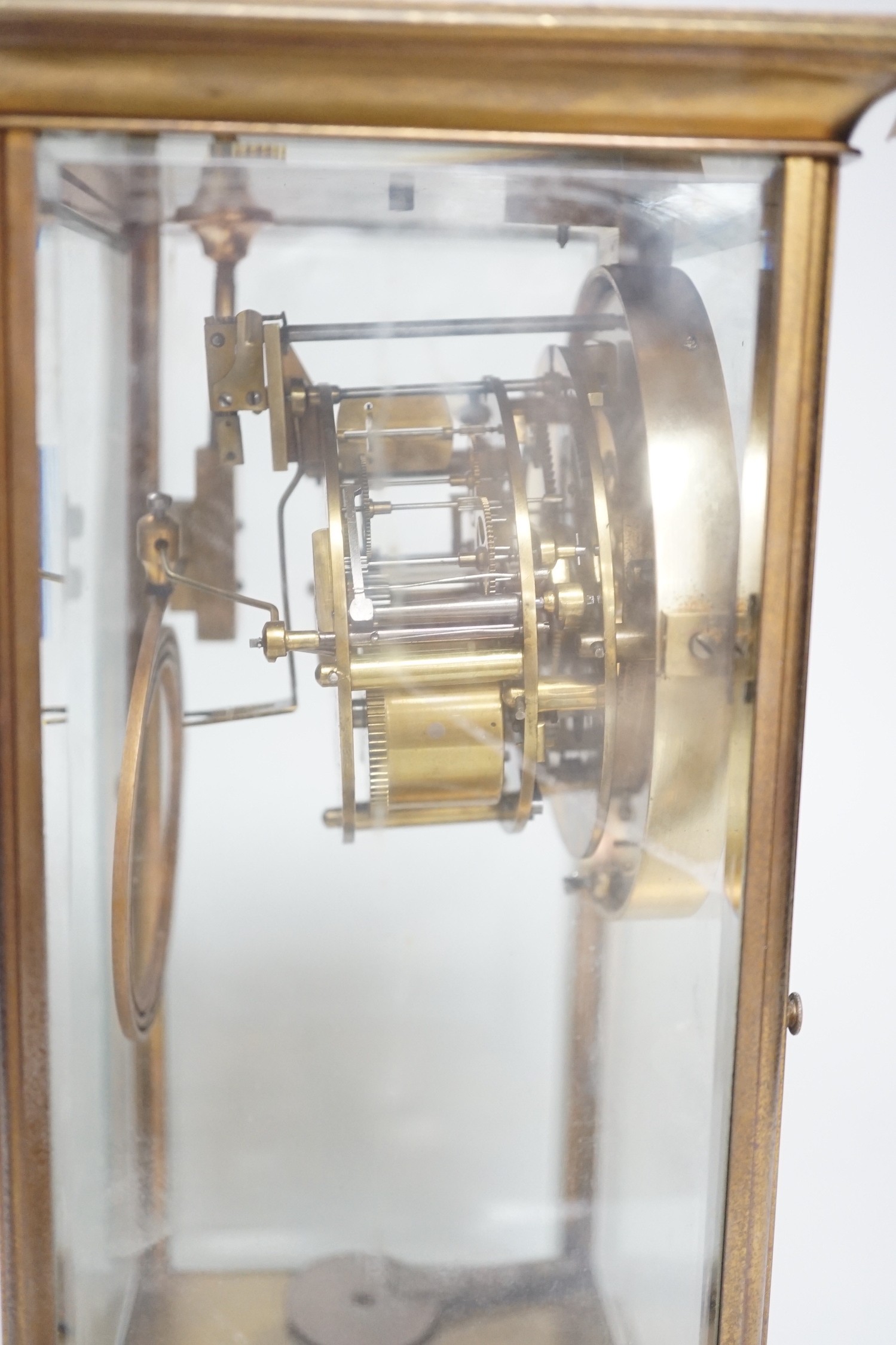 An Edwardian brass four-glass mantel clock with pendulum, presentation plaque to base, 30cm tall - Image 4 of 5