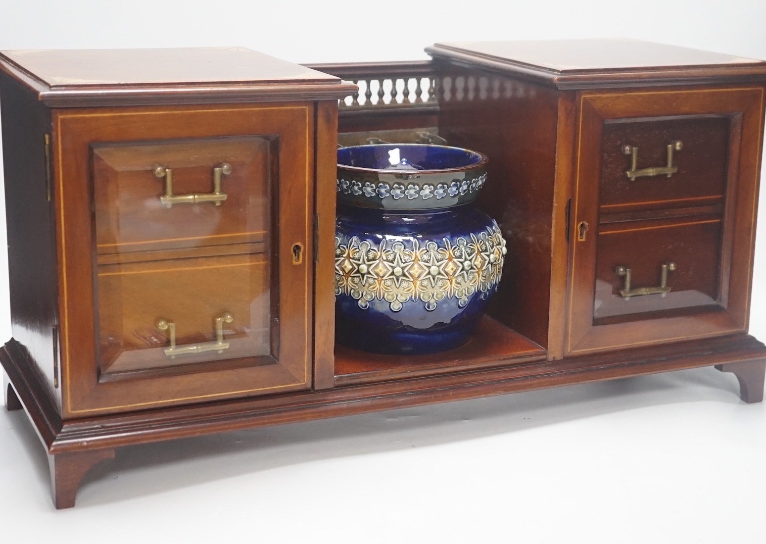 An Edwardian inlaid mahogany smoker's compendium with Doulton Lambeth stoneware tobacco jar, 52cm