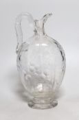 A 19th century Stourbridge ‘’rock crystal’’ claret jug. (cracked). 26.5cm tall