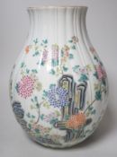 A Chinese famille rose lobed baluster vase, Qianlong seal mark but later. 30cm tall