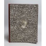 A George V repousse silver mounted blotter pad, Synyer & Beddoes, Birmingham, 1912, 29.5cm.