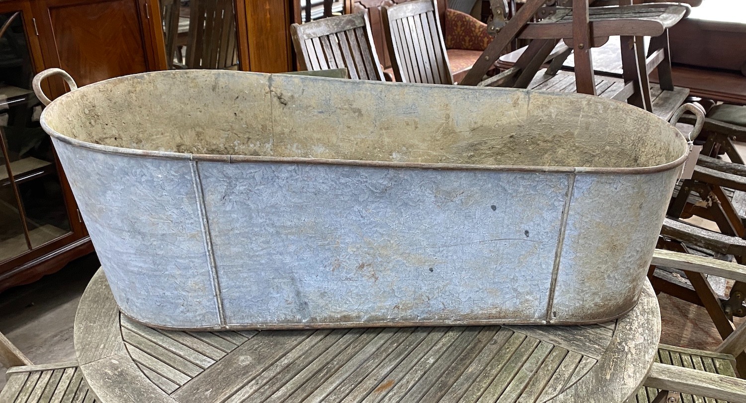 A large galvanised two handled trough, length 127cm, height 39cm