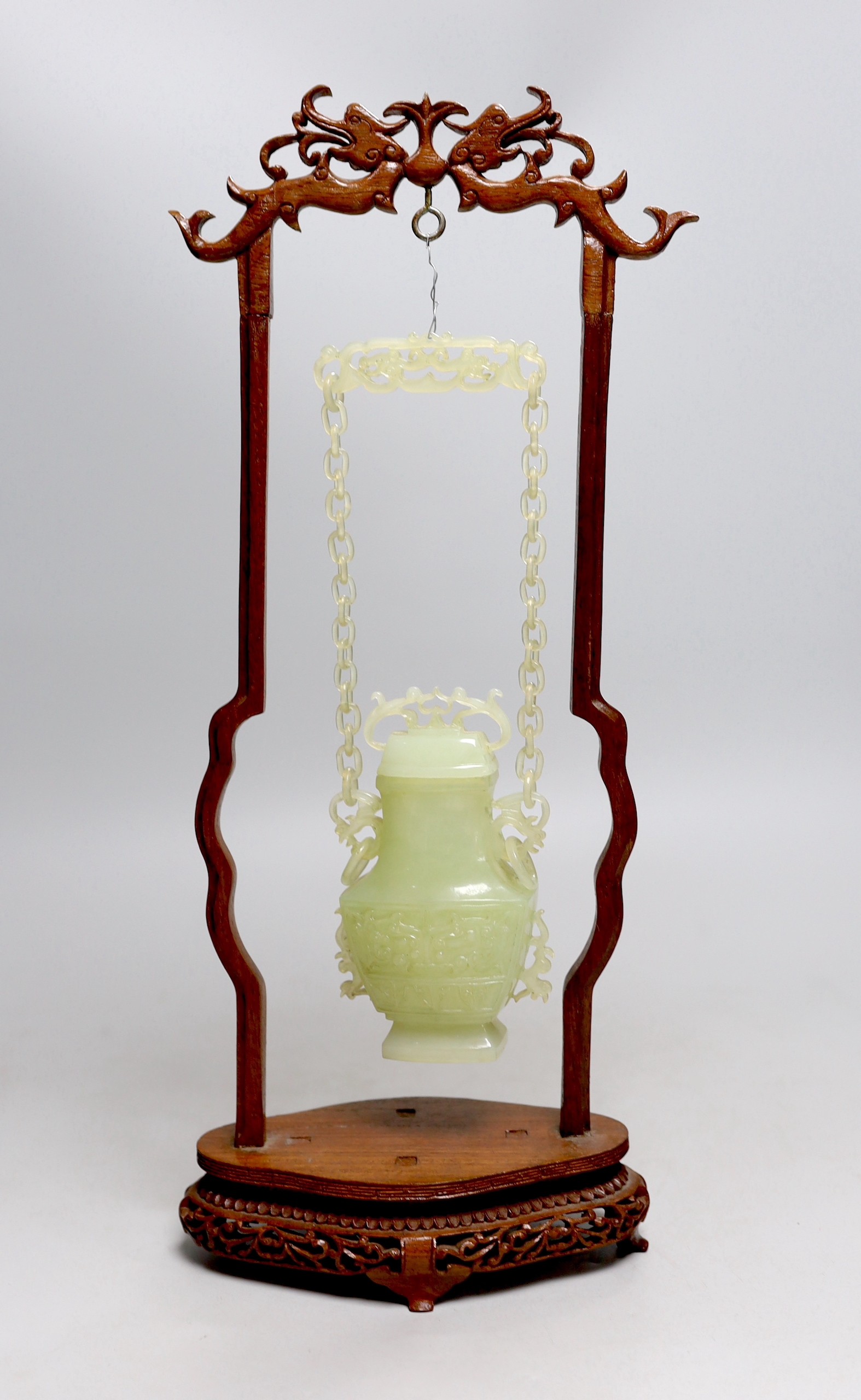 A Chinese bowenite jade hanging vase and cover together with a carved hard wood stand, one foot - Image 3 of 5