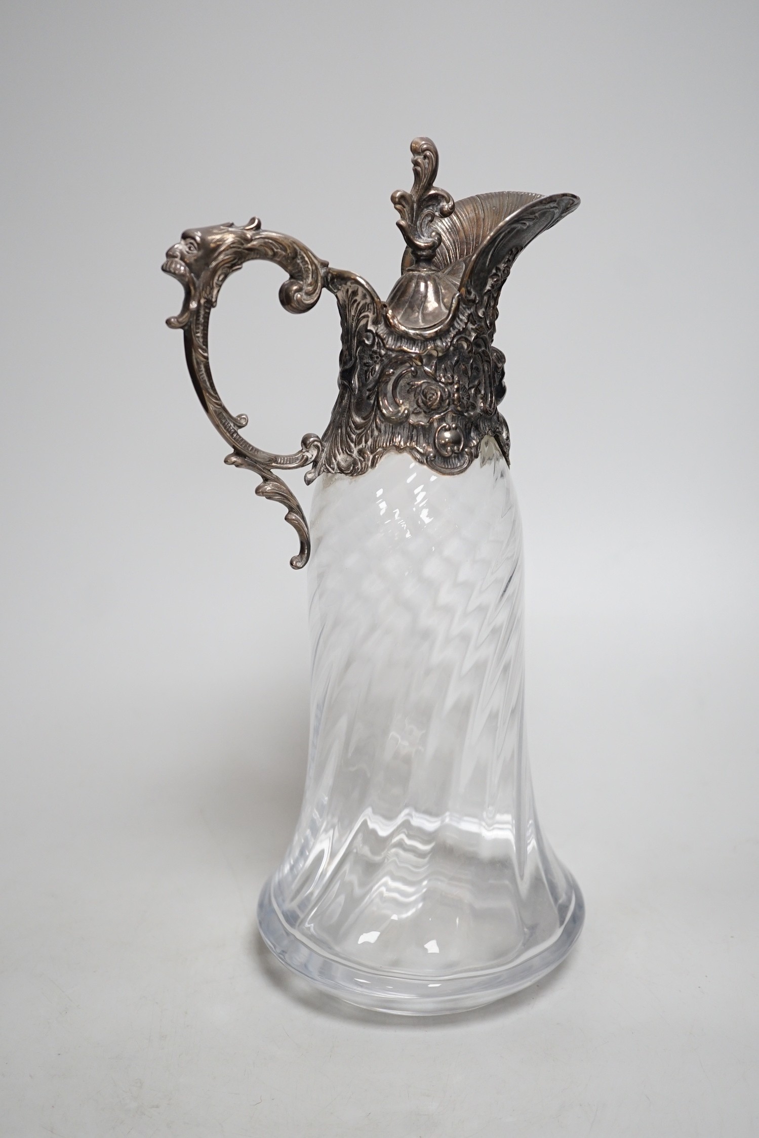 A Victorian rococo style electroplate mounted glass claret jug. 33cm tall - Image 4 of 5