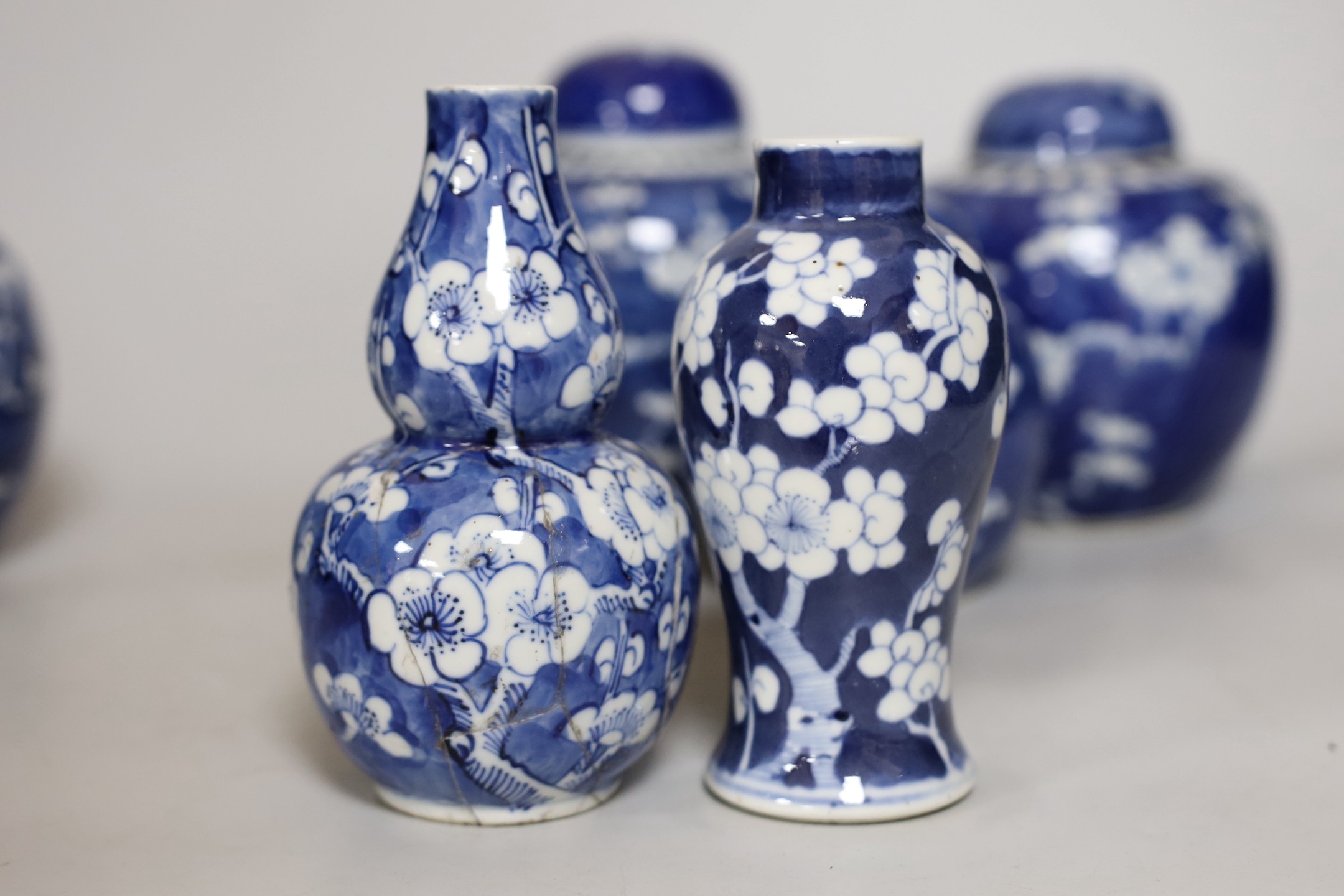 Four Chinese blue and white prunus pattern ginger jars, together with three similar vases. 19th/ - Image 5 of 10
