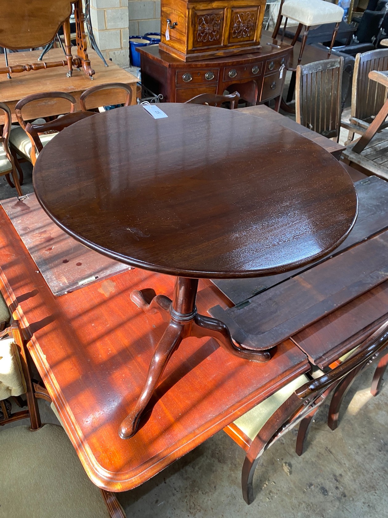 A George III mahogany circular tilt top tripod tea table, diameter 66cm, height 70cm - Image 2 of 2