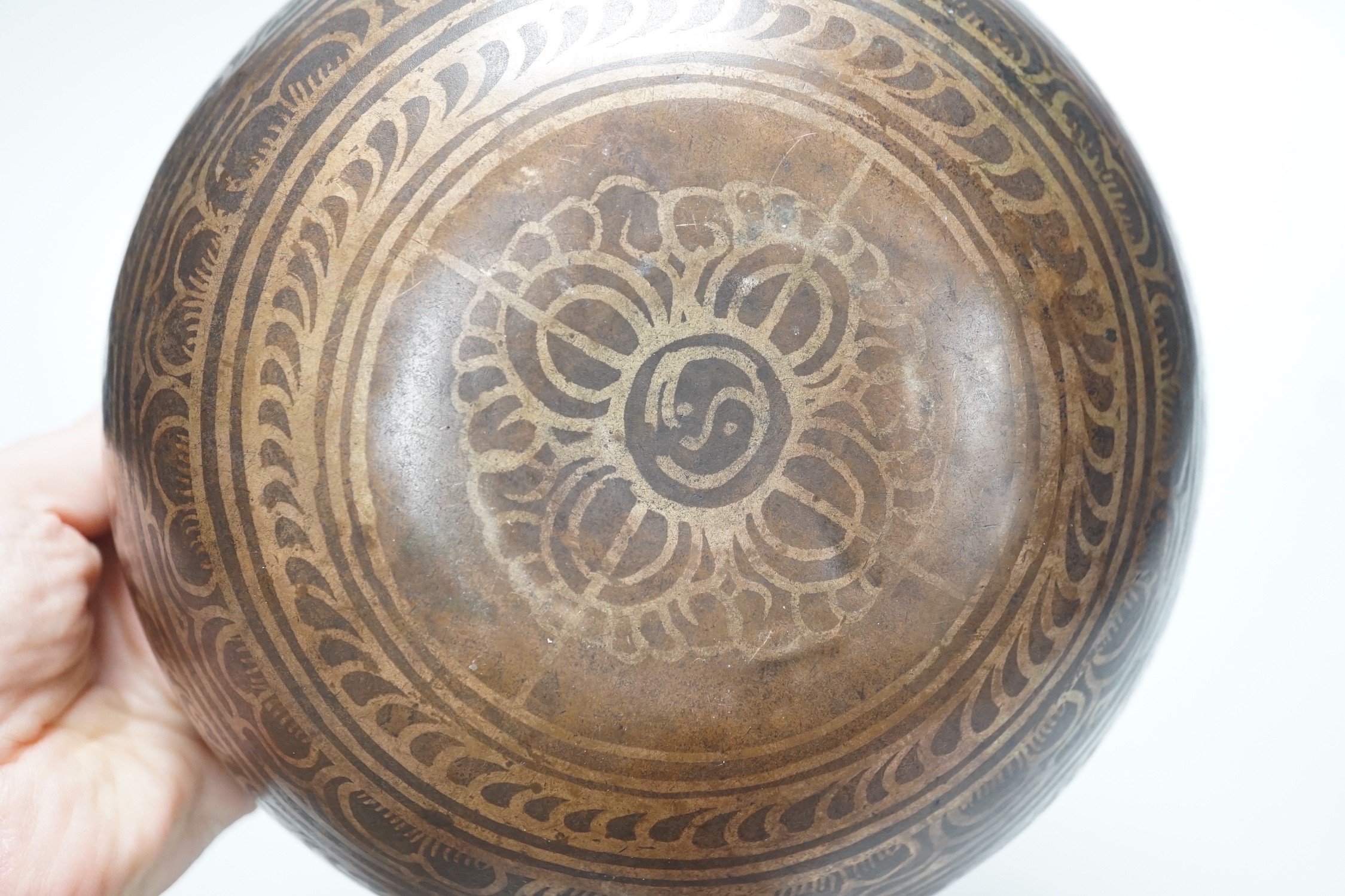 A bronze Nepalese temple bowl decorated with script, 18cm diameter - Image 5 of 5