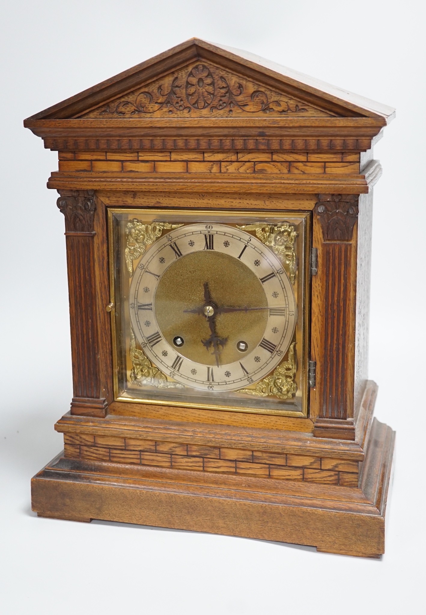 A late 19th century German oak mantel clock, 40.5cm