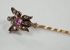 A Victorian yellow metal, pink stone and rose cut diamond set bug stick pin, 72mm, gross weight 1.