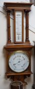 A Victorian Spiridon & Son oak cased barometer / thermometer. Approx 100cm tall