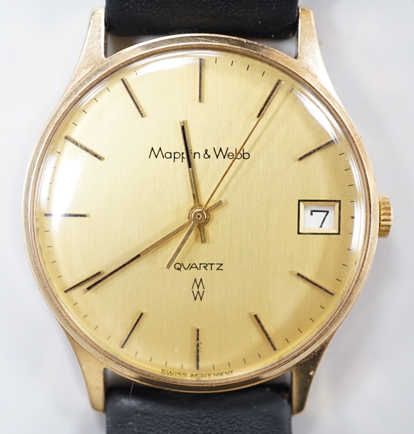 A gentleman's yellow metal quartz dress wrist watch, retailed by Mappin & Webb, with date