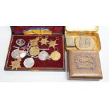 A quantity of war medals, Leicestershire brass paperweight, a carved box Somme Trench art match case