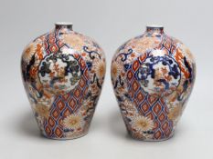 A pair of Japanese Fukugawa Imari bottle vases, signed. 19cm tall
