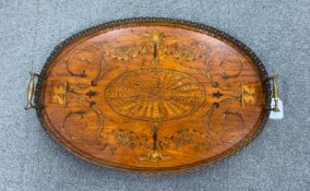 An Edwardian oval marquetry inlaid mahogany galleried tea tray, width 58cm, depth 40cm
