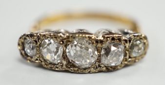 An 18ct, plat and graduated five stone diamond set half hoop ring, size J/K, gross weight 3.3