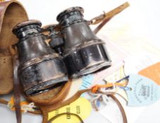 A pair of French binoculars in case, with various race meeting badges