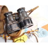 A pair of French binoculars in case, with various race meeting badges