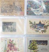 A selection of early 20th century postcards in an album, to include novelty, Christmas, Happy New