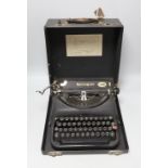 A cased Remington, British made, portable typewriter, 30cms deep