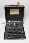 A cased Remington, British made, portable typewriter, 30cms deep