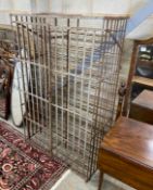 A vintage French wrought iron wine cage, width 102cm, depth 56cm, height 164cm