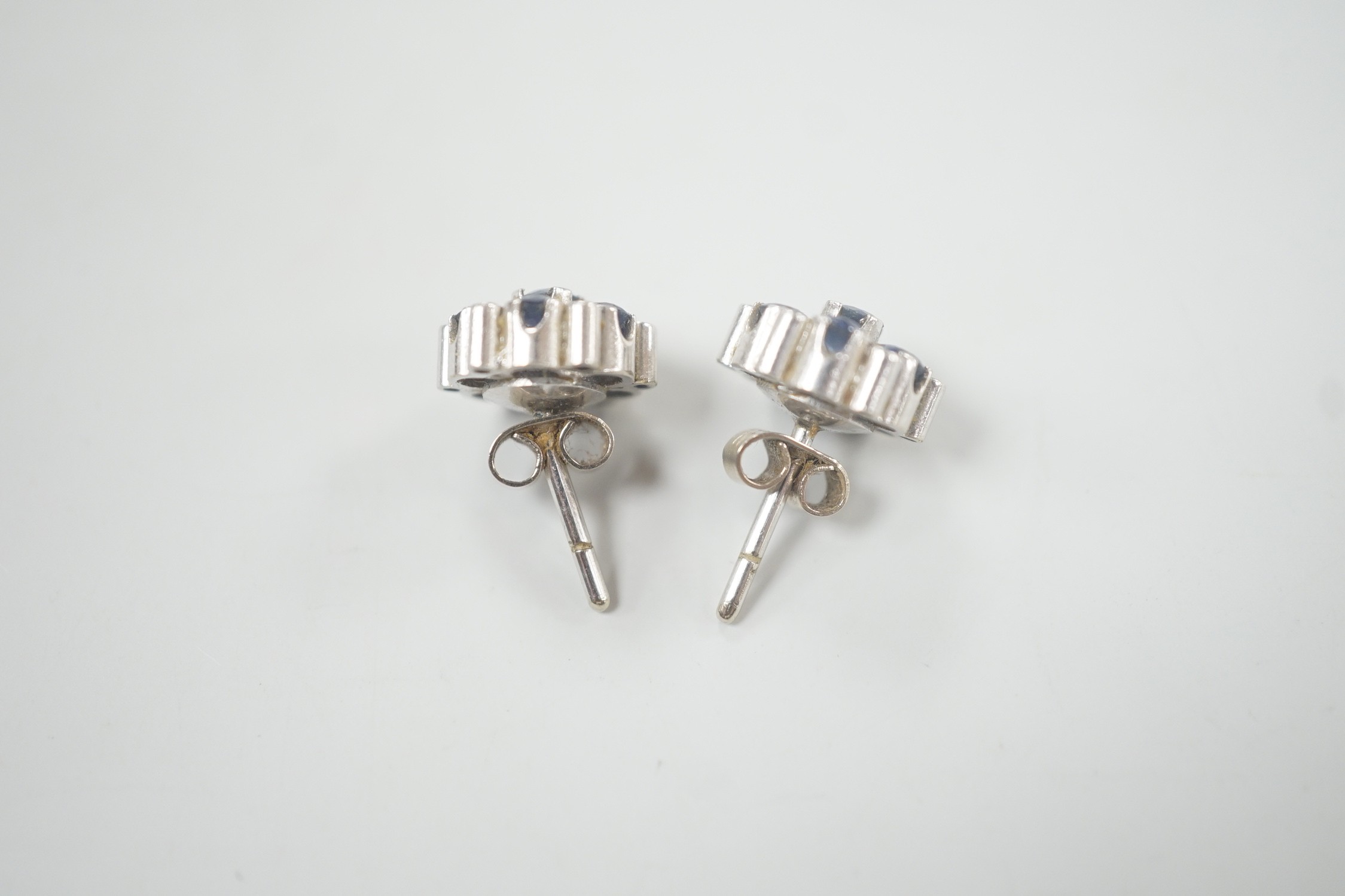 A pair of white metal, sapphire and diamond cluster set flower head ear studs, 10mm, gross weight - Image 6 of 6
