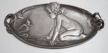 An unmarked, (possibly WMF) stamped 210 on base, an Art Nouveau pewter dish with a child