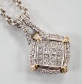 A modern 14k yellow and white metal, pave set diamond pendant, 23mm, on a Chinese? white metal