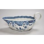 An 18th century Worcester sauceboat painted in underglaze blue in the full moon pattern. 23cm wide