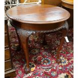 An early 20th century Chippendale revival circular mahogany centre table, diameter 73cm, height