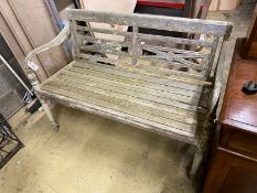 A weathered hardwood garden bench, length 115cm, depth 49cm, height 85cm